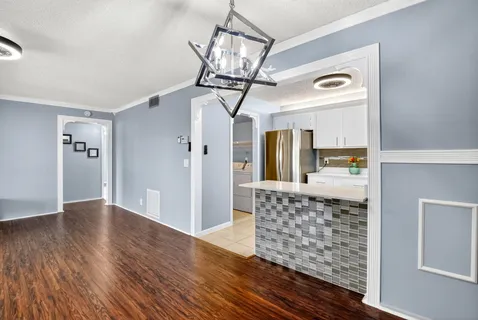 a view of livingroom with furniture and wooden floor