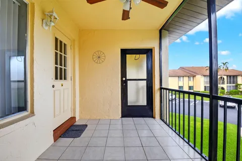 a view of a porch with wooden floor