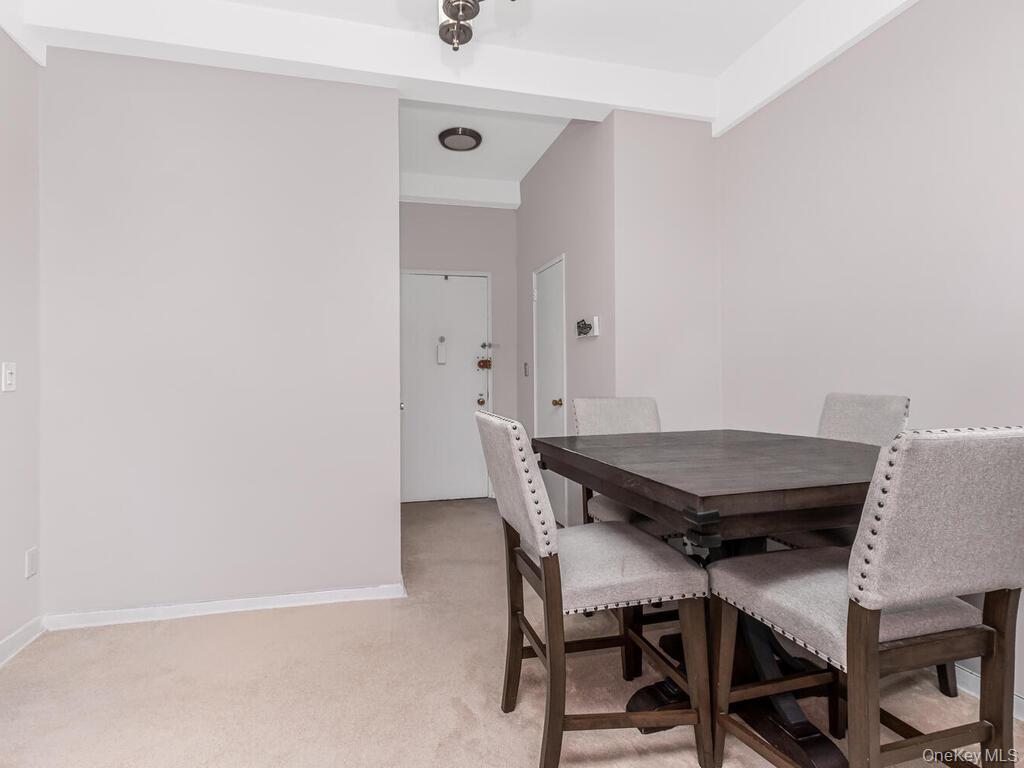 245 Rumsey Road, Unit 20 Yonkers, NY 10701 - Photo 4 of 14 a view of a room with furniture and wooden floor