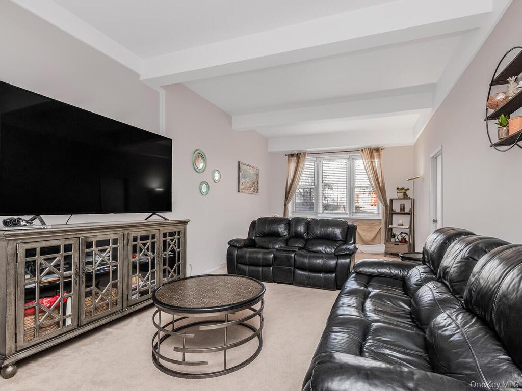 245 Rumsey Road, Unit 20 Yonkers, NY 10701 - Photo 6 of 14 a living room with furniture and a flat screen tv