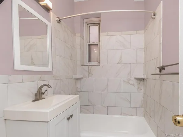 a bathroom with a sink and shower