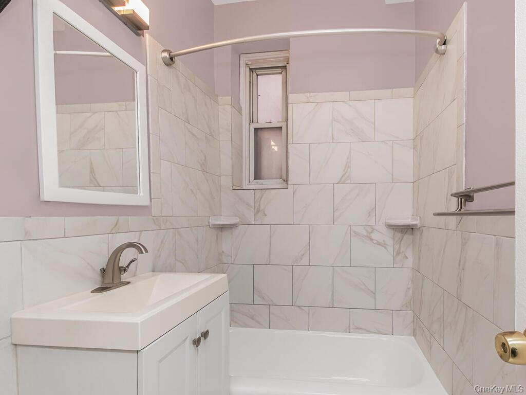 245 Rumsey Road, Unit 20 Yonkers, NY 10701 - Photo 9 of 14 a bathroom with a sink and shower