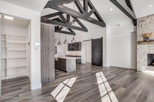 a view of a house next to a lake with a big yard