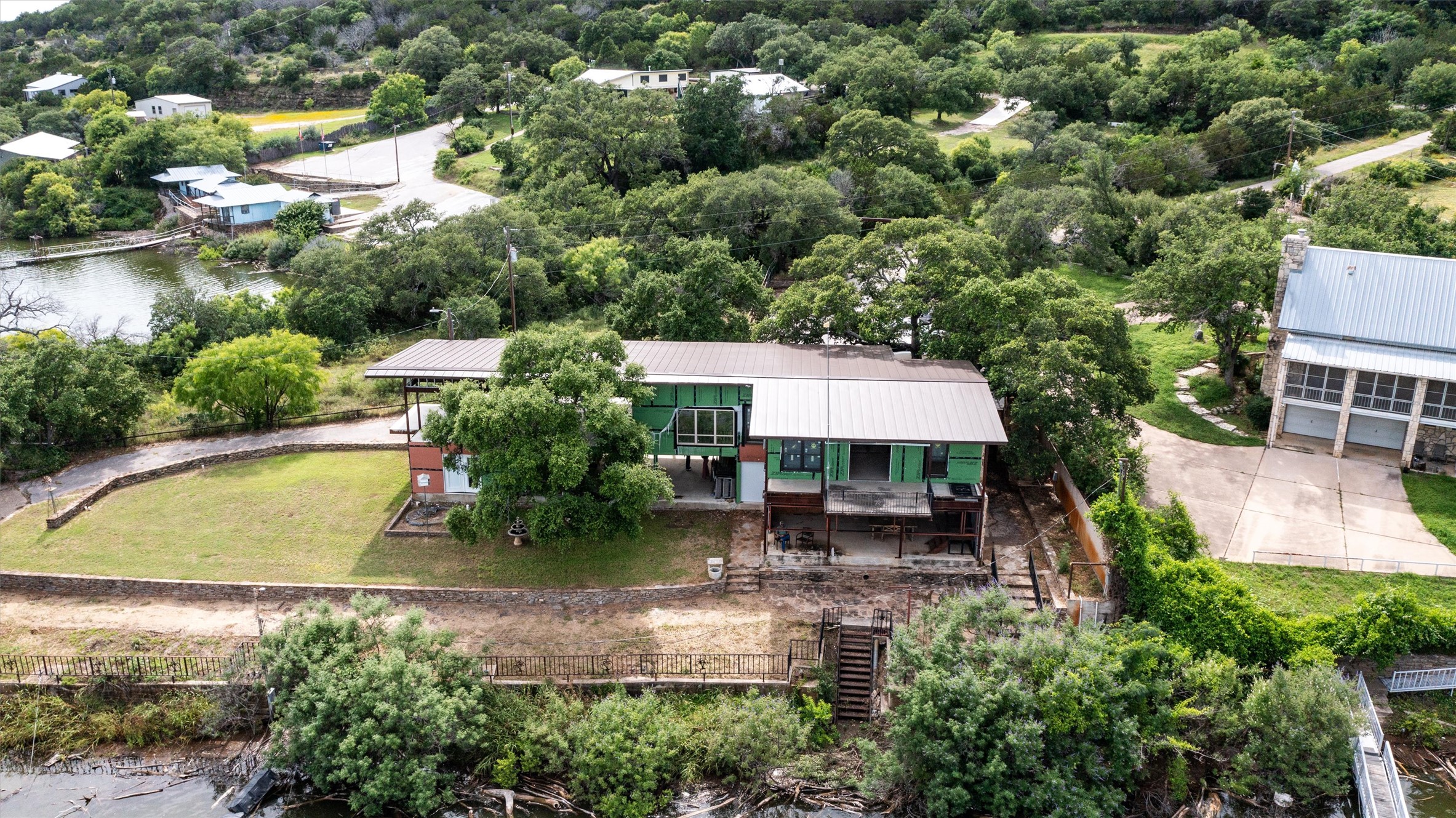 325 Eagle Rest Burnet, TX 78611 - Photo 7 of 40 Perched above the water, this home offers private lake access and mature trees for natural shade.