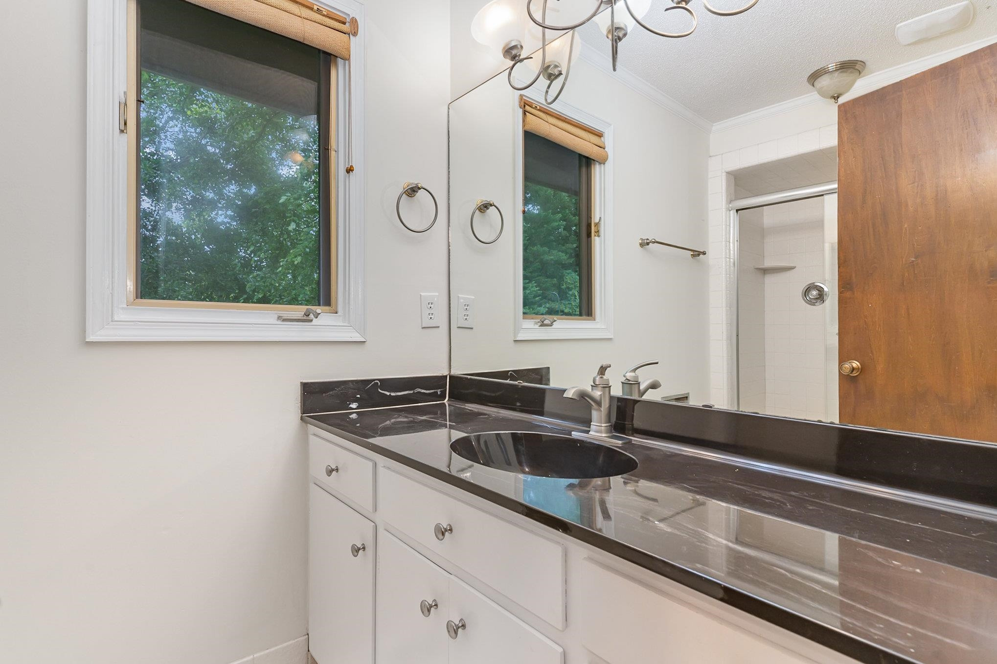 425 Sledge Road Louisburg, NC 27549 - Photo 12 of 30 a bathroom with a sink and a mirror