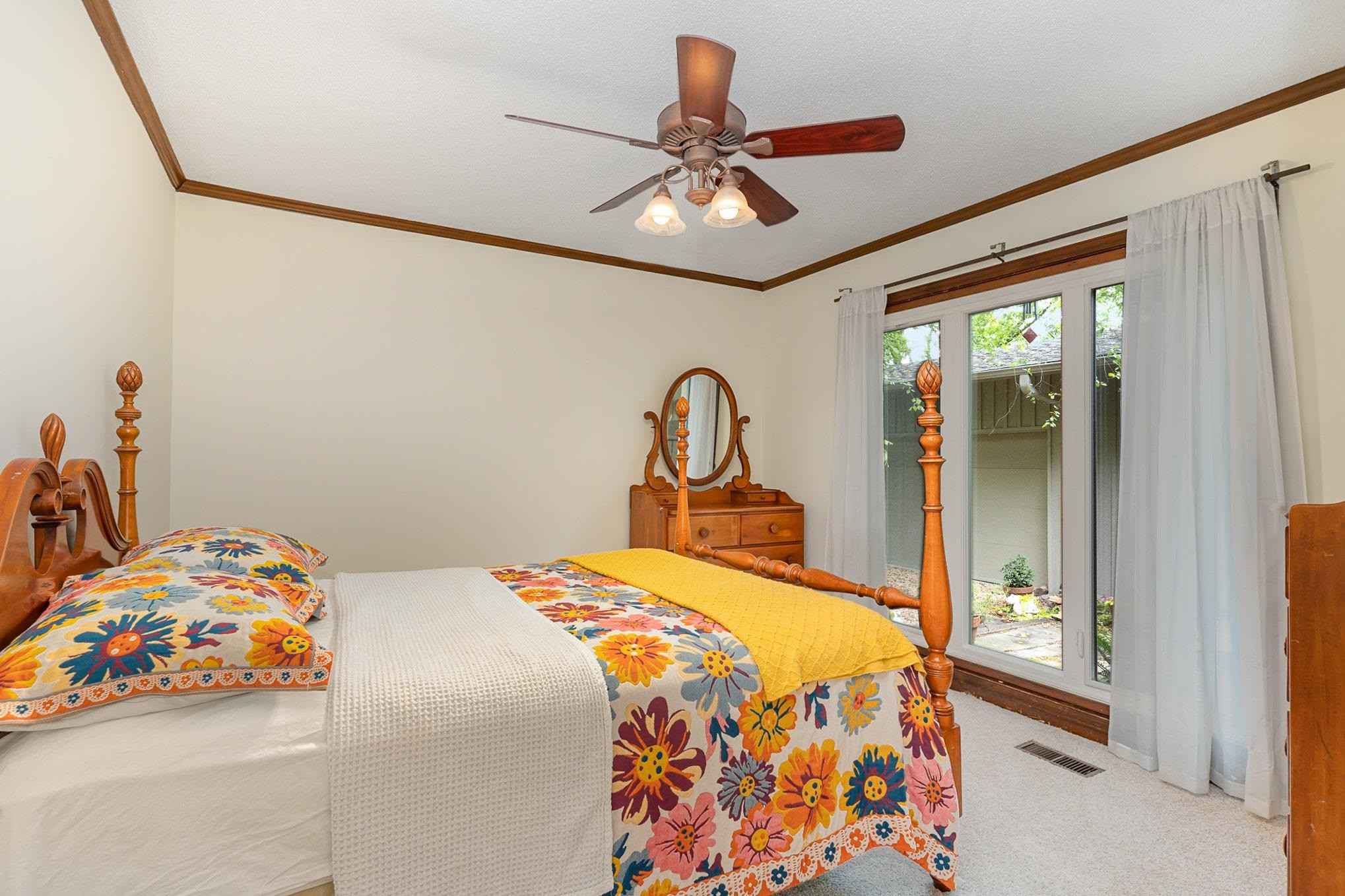 425 Sledge Road Louisburg, NC 27549 - Photo 13 of 30 a bedroom with a bed and a chandelier