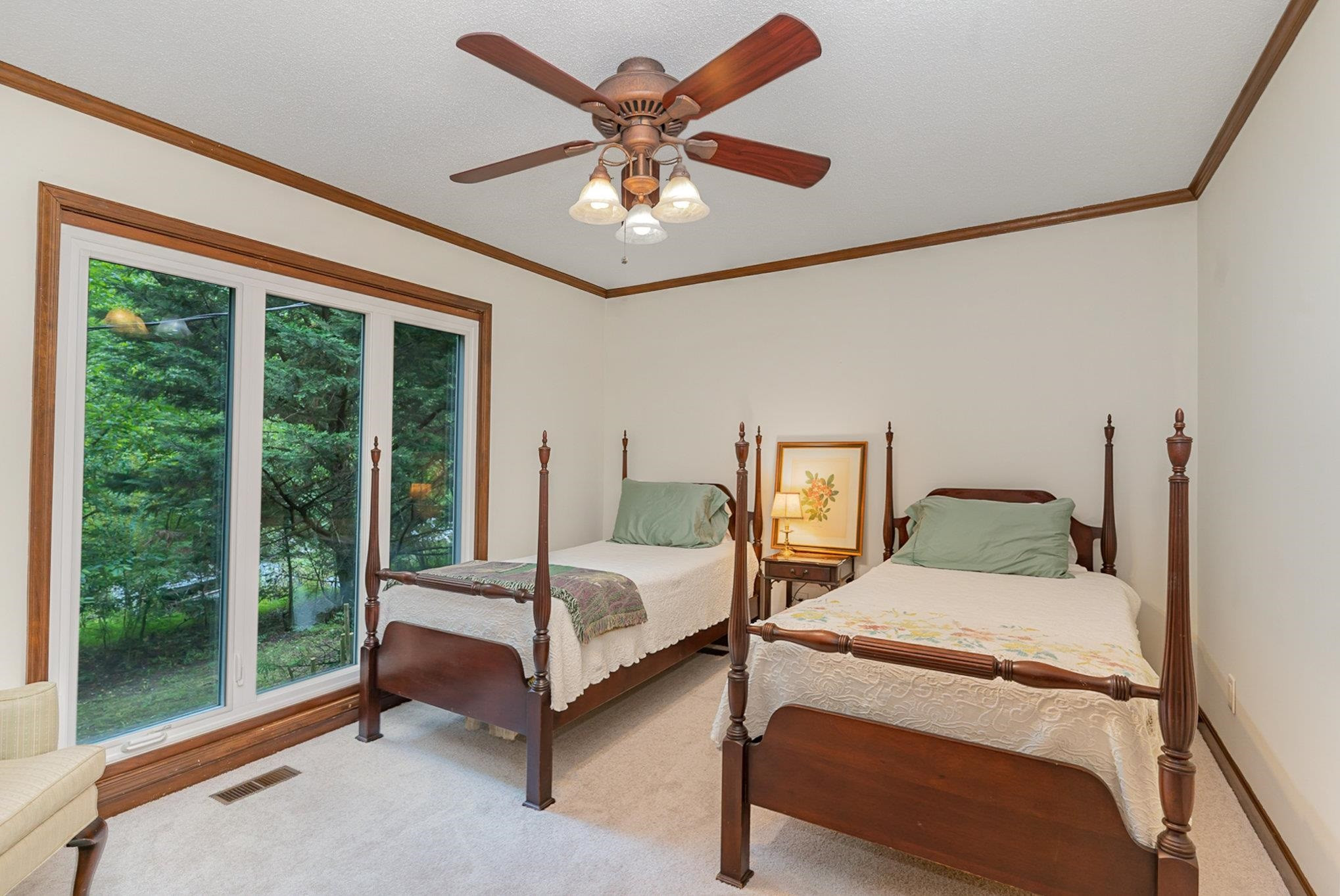 425 Sledge Road Louisburg, NC 27549 - Photo 14 of 30 a bedroom with a bed and a large window