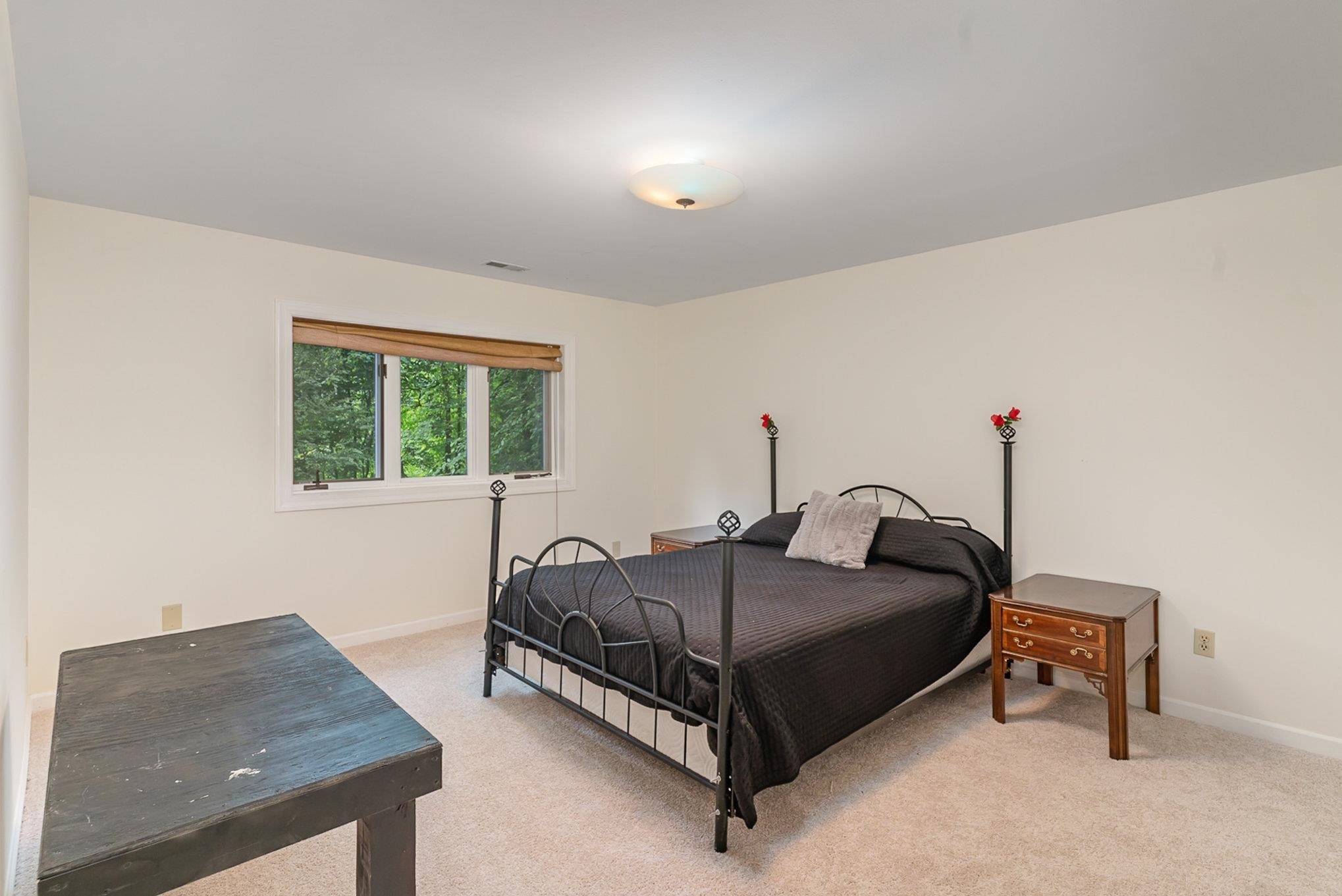 425 Sledge Road Louisburg, NC 27549 - Photo 15 of 30 a bedroom with a bed and a window