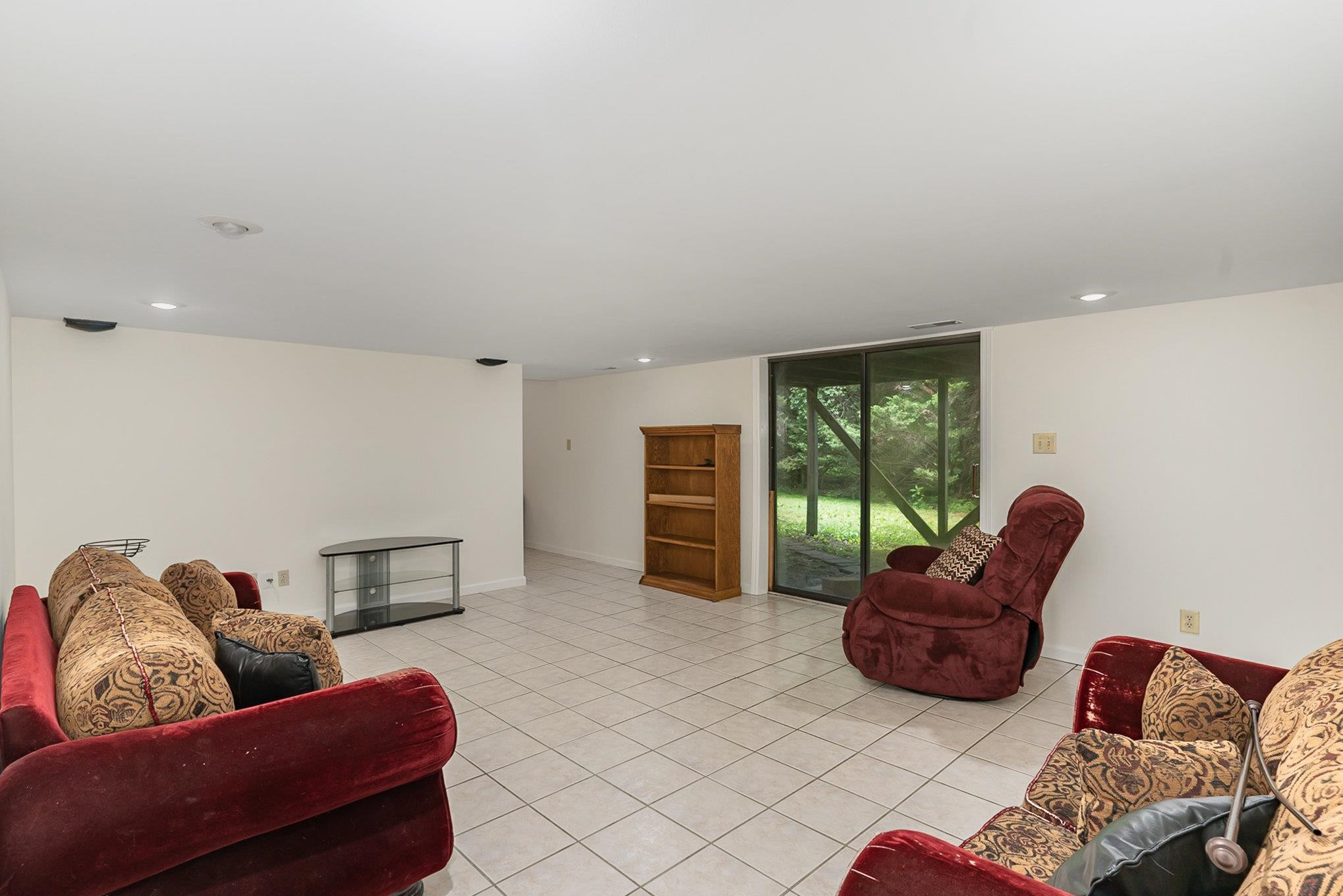 425 Sledge Road Louisburg, NC 27549 - Photo 18 of 30 a bed room with furniture and a large window