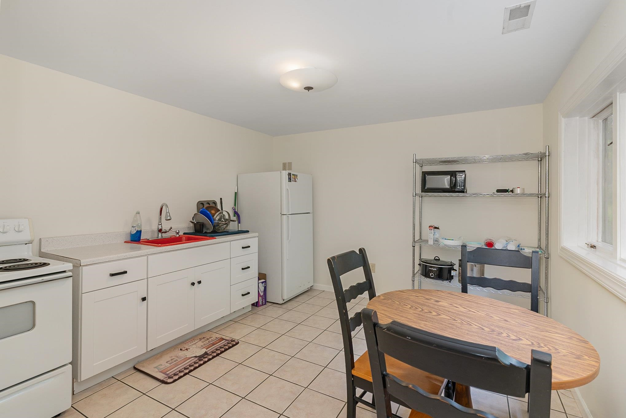 425 Sledge Road Louisburg, NC 27549 - Photo 20 of 30 a view of a dining room with furniture