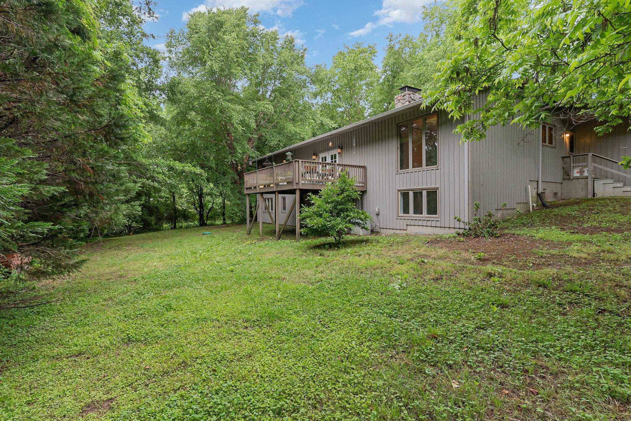 425 Sledge Road Louisburg, NC 27549 - Photo 25 of 30 a backyard of a house with plants and tree