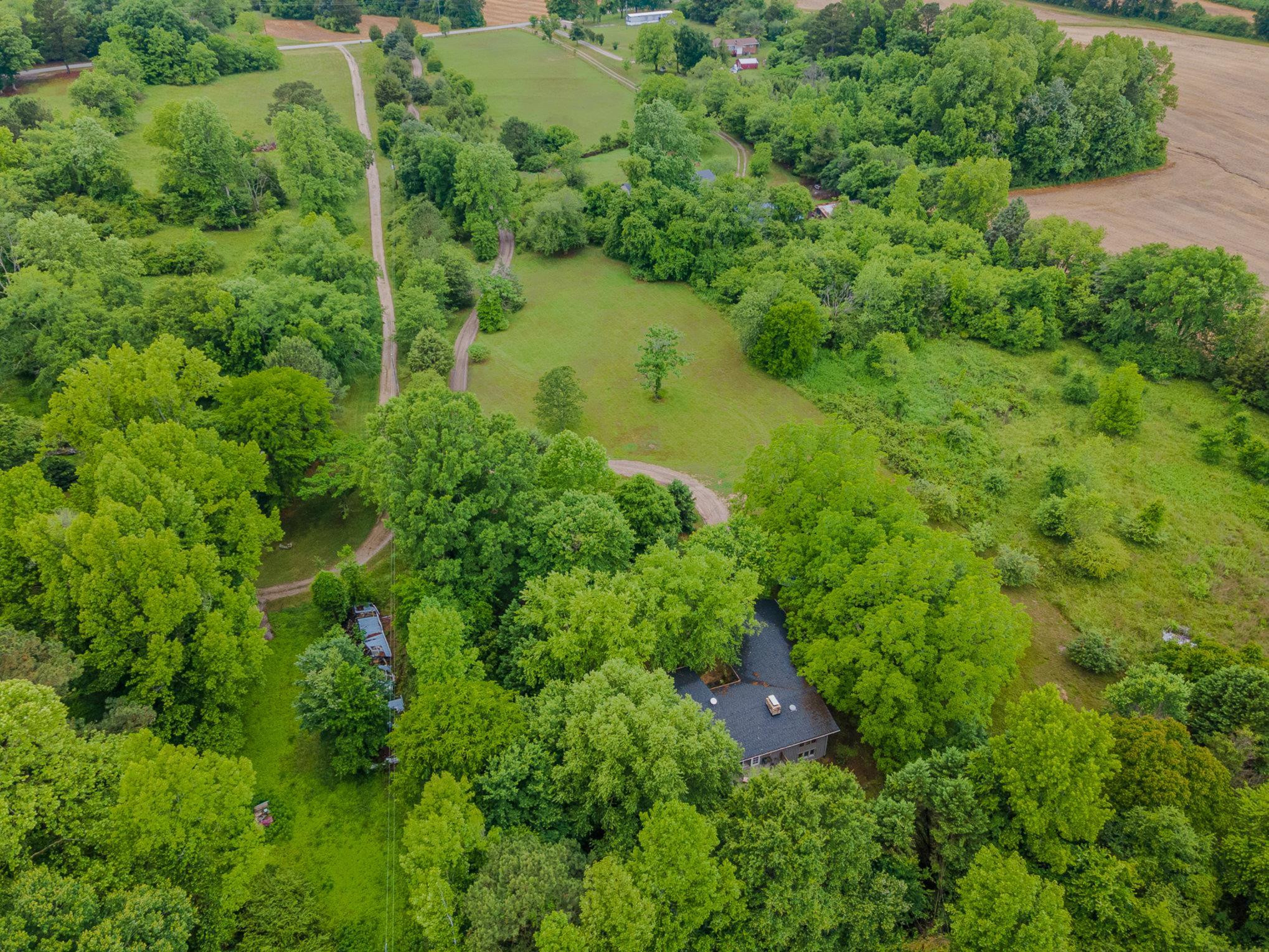 425 Sledge Road Louisburg, NC 27549 - Photo 26 of 30 an aerial view of residential house with outdoor space and trees all around