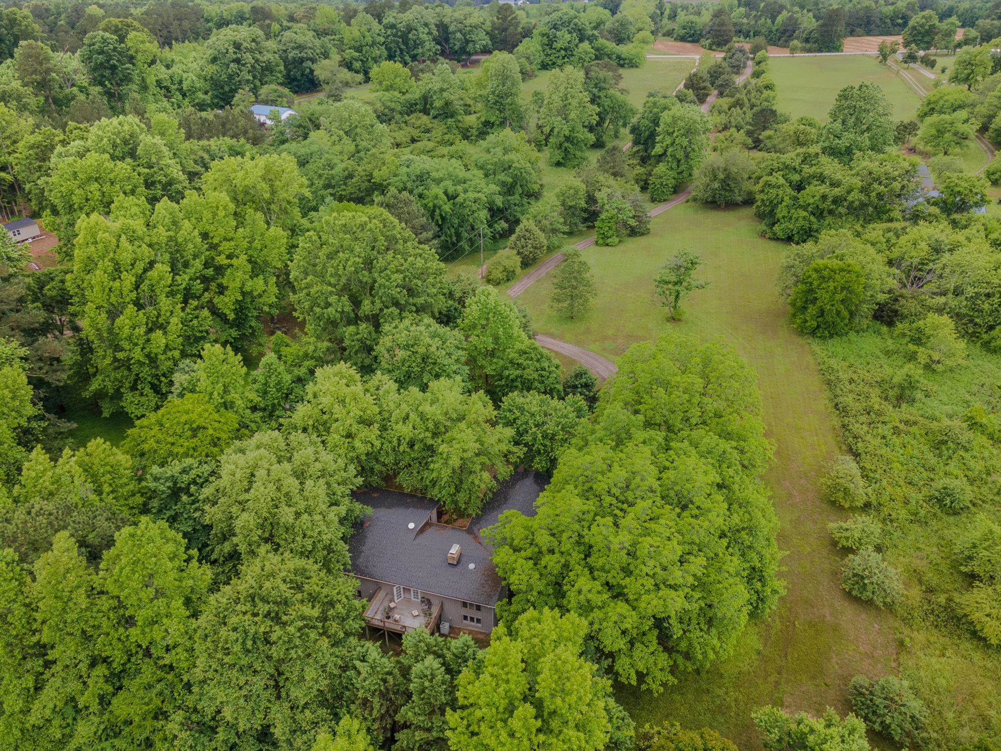 425 Sledge Road Louisburg, NC 27549 - Photo 27 of 30 an aerial view of residential house with outdoor space and trees all around