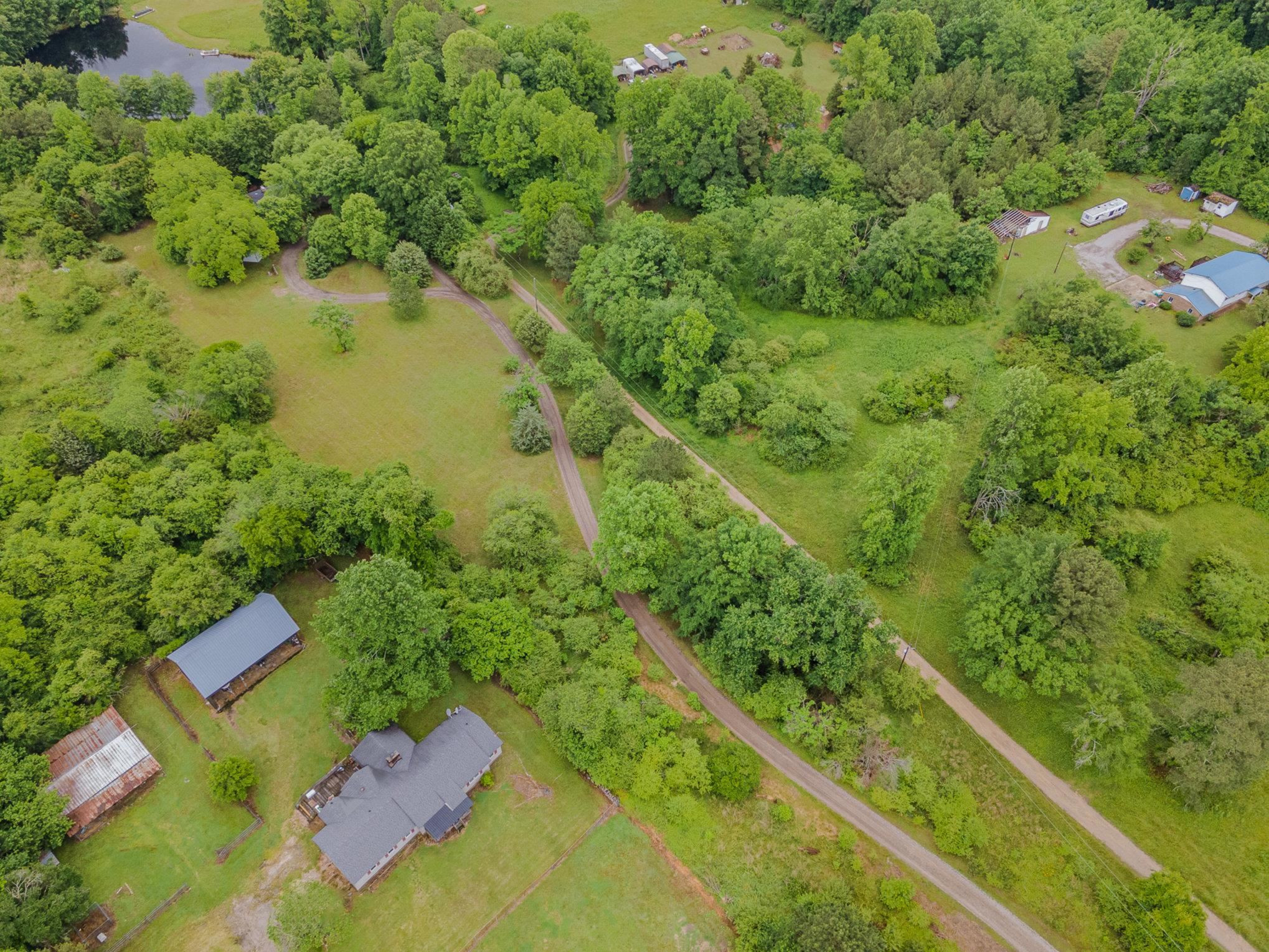 425 Sledge Road Louisburg, NC 27549 - Photo 28 of 30 a view of a garden with a lake