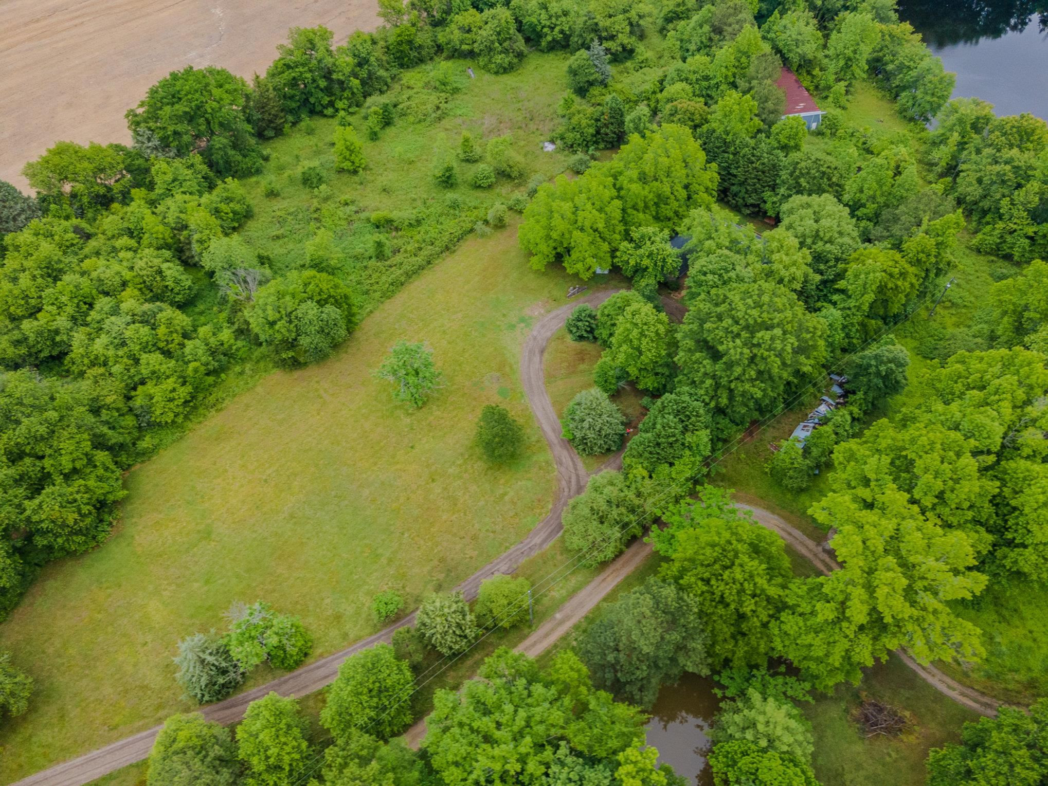 425 Sledge Road Louisburg, NC 27549 - Photo 29 of 30 an aerial view of residential houses with outdoor space and trees all around