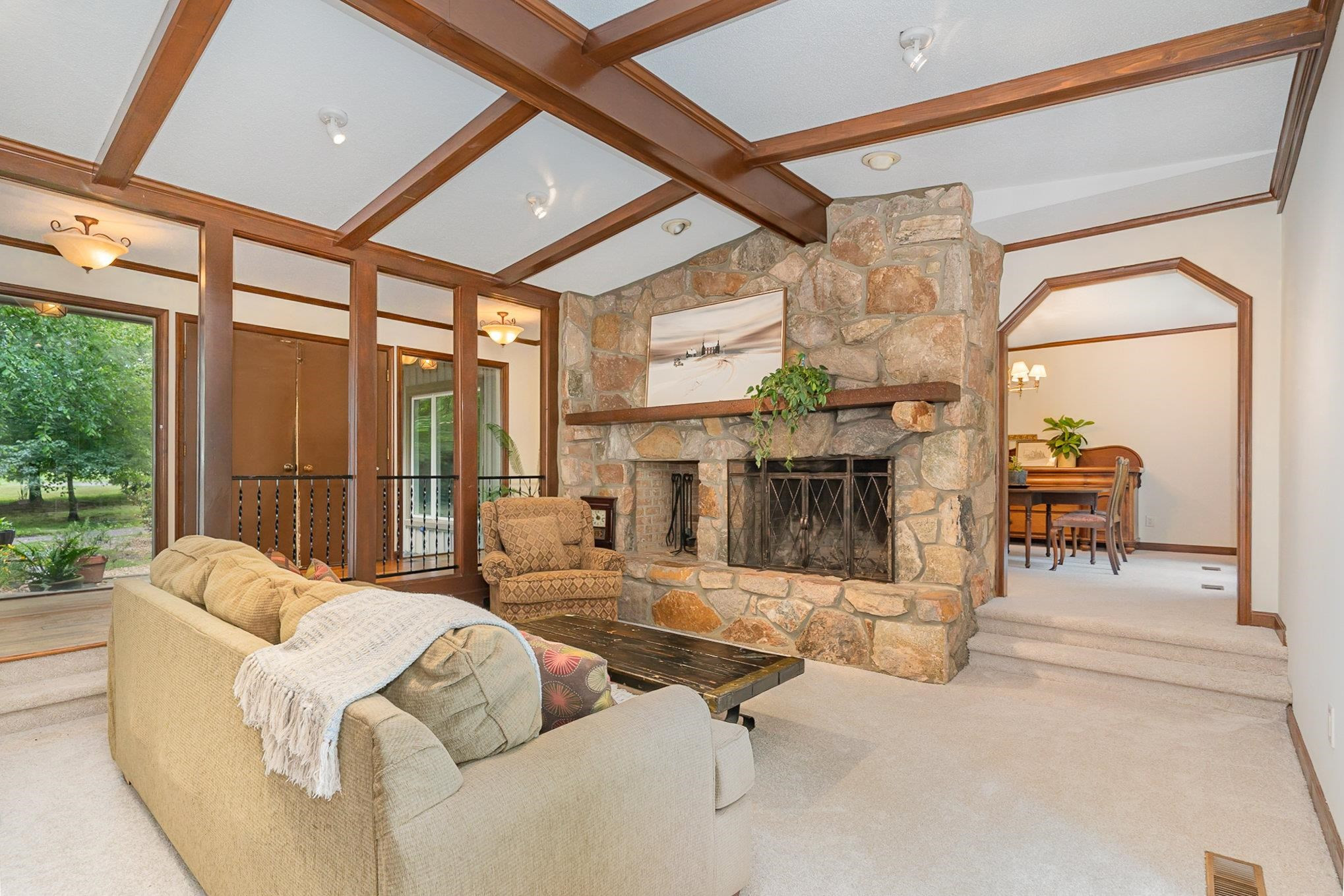 425 Sledge Road Louisburg, NC 27549 - Photo 7 of 30 a living room with furniture a fireplace and a table