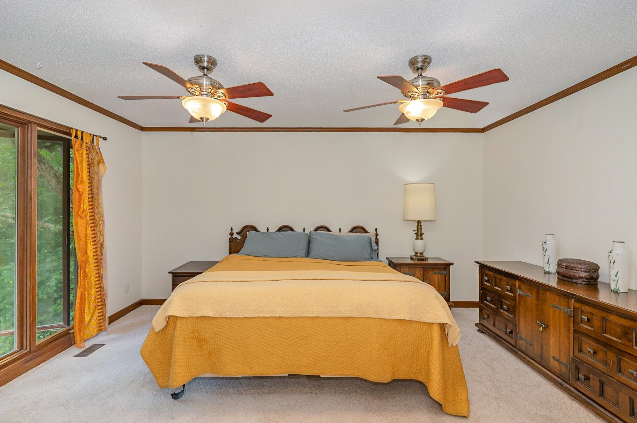 425 Sledge Road Louisburg, NC 27549 - Photo 10 of 30 a bedroom with a bed and a chandelier