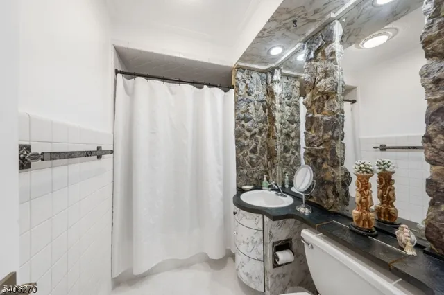 a kitchen with stainless steel appliances kitchen island granite countertop a sink and cabinets