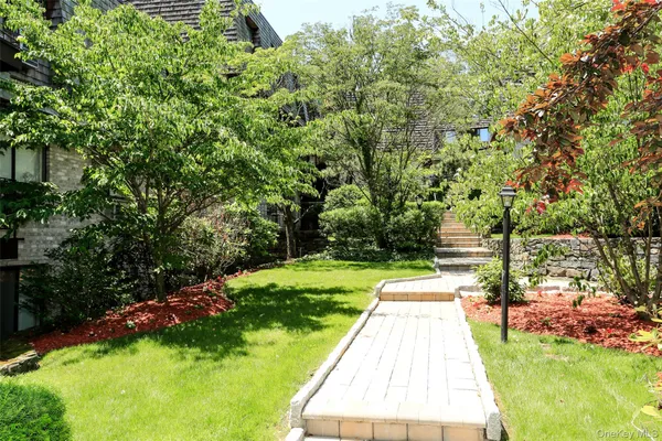 a view of a backyard with swimming pool