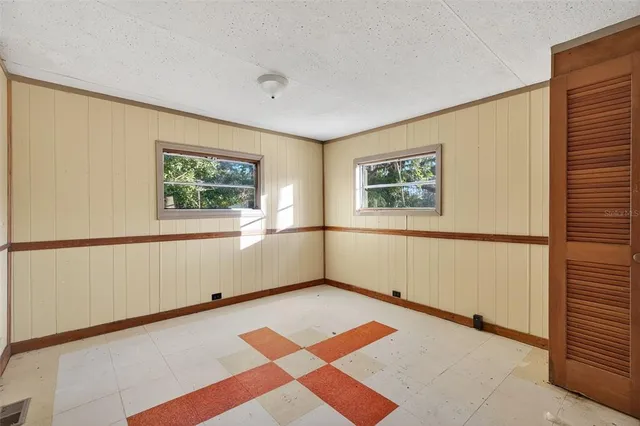 a view of an empty room with a window