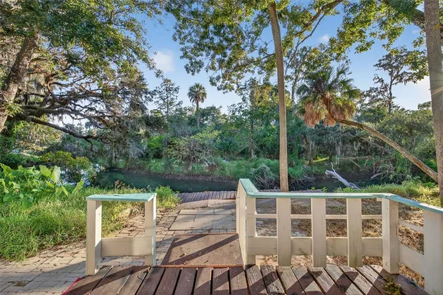 a view of a chairs and table on the wooden deck
