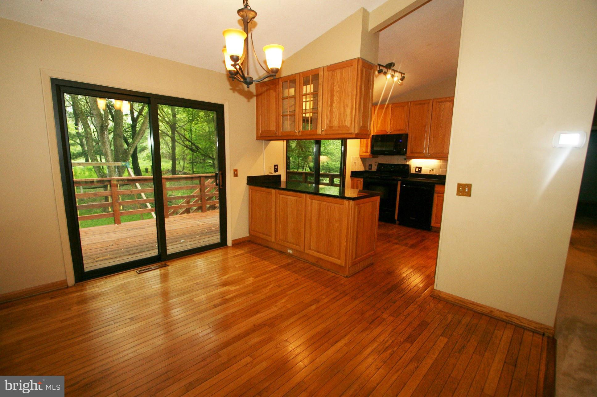 5332 Lightning View Road Columbia, MD 21045 - Photo 7 of 23 HARDWOOD FLOOR AND SLIDER TO DECK