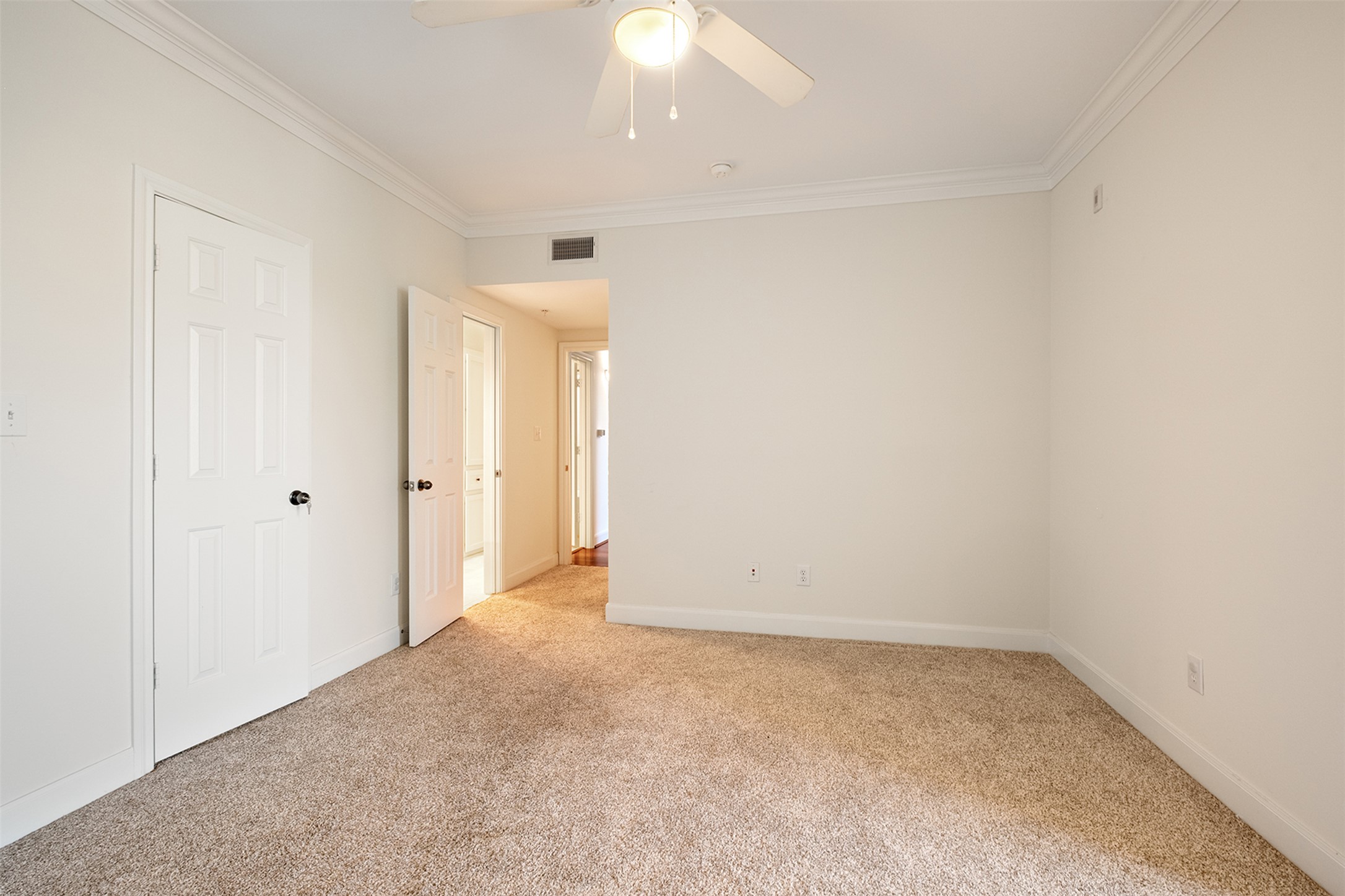 7701 Rialto Boulevard, Unit 637 Austin, TX 78735 - Photo 20 of 25 A well-lit bedroom provides comfortable living space with a ceiling fan for climate control.