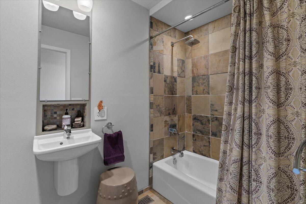 5229 Pioneer Road Medford, OR 97501 - Photo 29 of 62 Custom bathroom with natural stone, shower/tub combo.