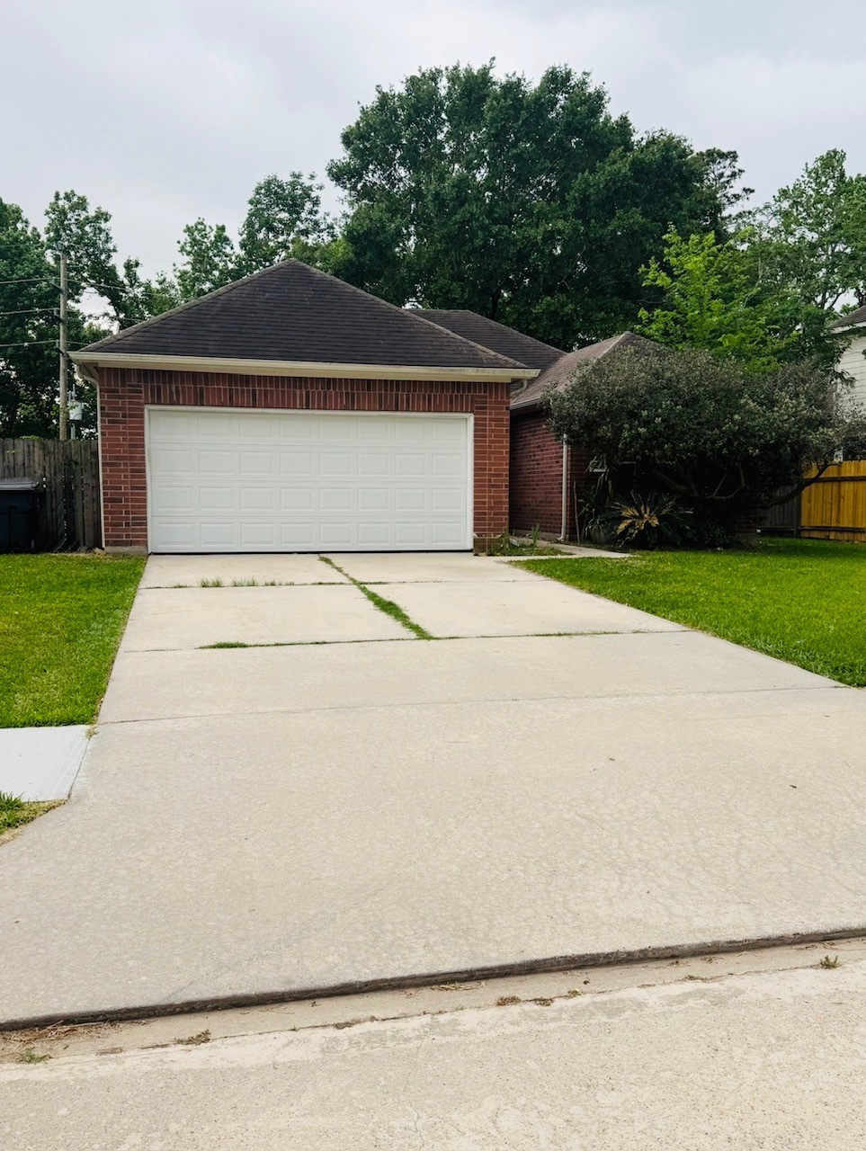 22115 Jay Drive Spring, TX 77373 - Photo 2 of 14 a white house with a large tree with yard