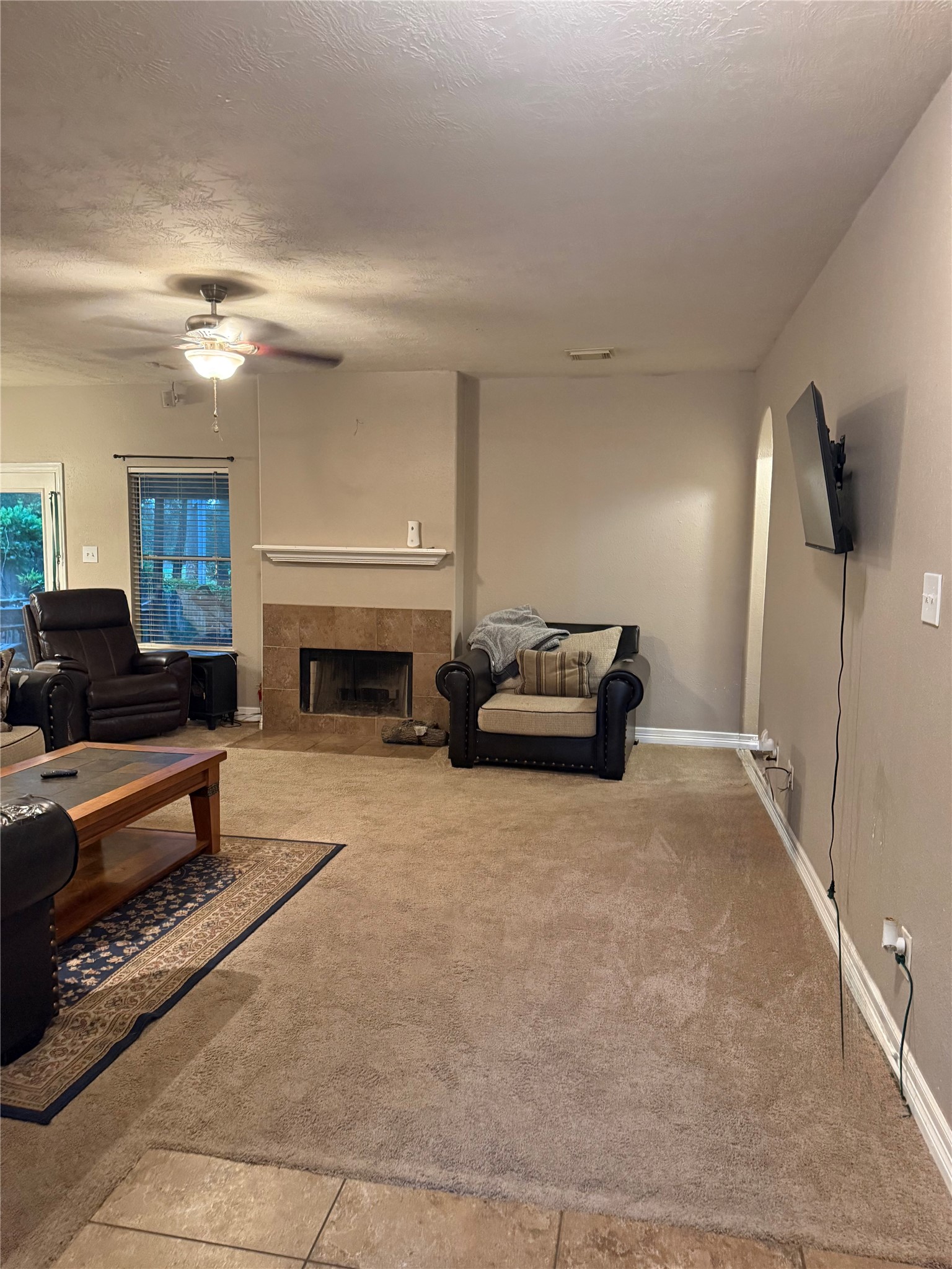 22115 Jay Drive Spring, TX 77373 - Photo 3 of 14 a living room with furniture and a fireplace