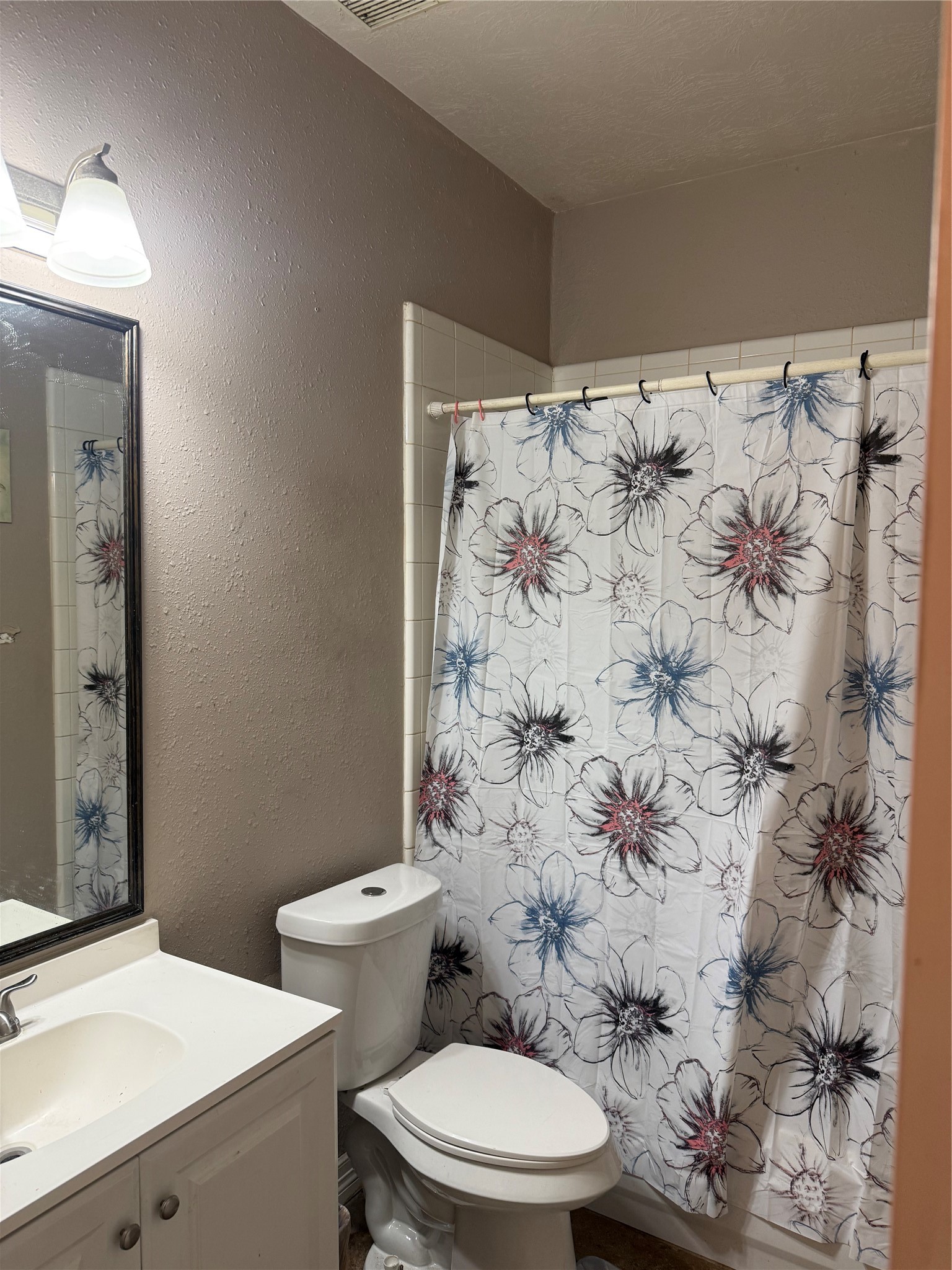 22115 Jay Drive Spring, TX 77373 - Photo 8 of 14 a white toilet sitting next to a bathroom sink