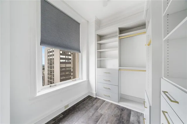 a bathroom with a shower a toilet and a sink