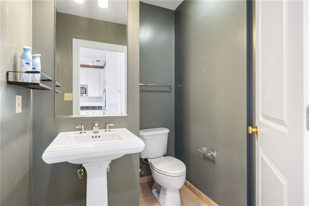 57 Forsyth Street Northwest, Unit 16G Atlanta, GA 30303 - Photo 15 of 27 a bathroom with a sink toilet and a mirror