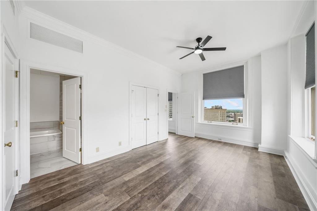 57 Forsyth Street Northwest, Unit 16G Atlanta, GA 30303 - Photo 16 of 32 wooden floor in an empty room with a window