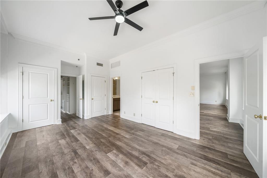 57 Forsyth Street Northwest, Unit 16G Atlanta, GA 30303 - Photo 19 of 32 a view of a room with wooden floor and white walls