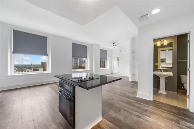 a kitchen with a sink stove and refrigerator