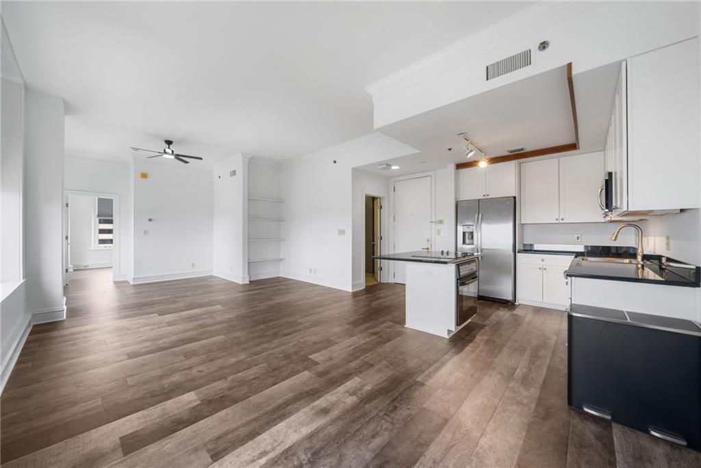 57 Forsyth Street Northwest, Unit 16G Atlanta, GA 30303 - Photo 3 of 27 a view of a kitchen with a sink and wooden floor