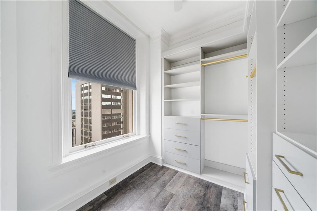 57 Forsyth Street Northwest, Unit 16G Atlanta, GA 30303 - Photo 9 of 27 a view of an empty room with cabinet and a window