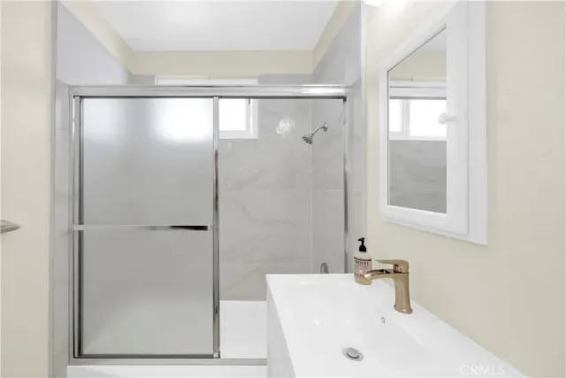 a bathroom with a tub and shower