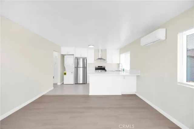 a view of kitchen with wooden floor
