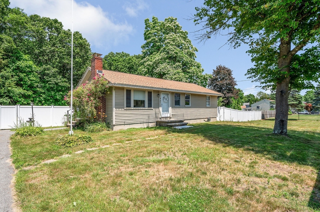 5 Silverbirch Road Billerica, MA 01821 - Photo 1 of 36 a backyard of a house with yard table and chairs