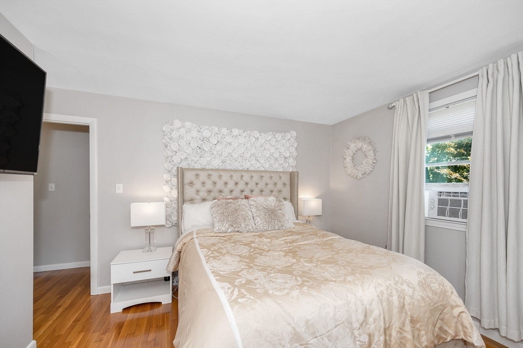 5 Silverbirch Road Billerica, MA 01821 - Photo 13 of 36 a bedroom with a bed and a flat tv screen on the dresser