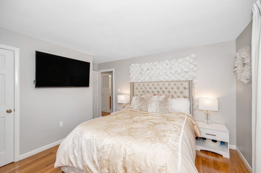 5 Silverbirch Road Billerica, MA 01821 - Photo 15 of 36 a bedroom with a bed and a flat screen tv