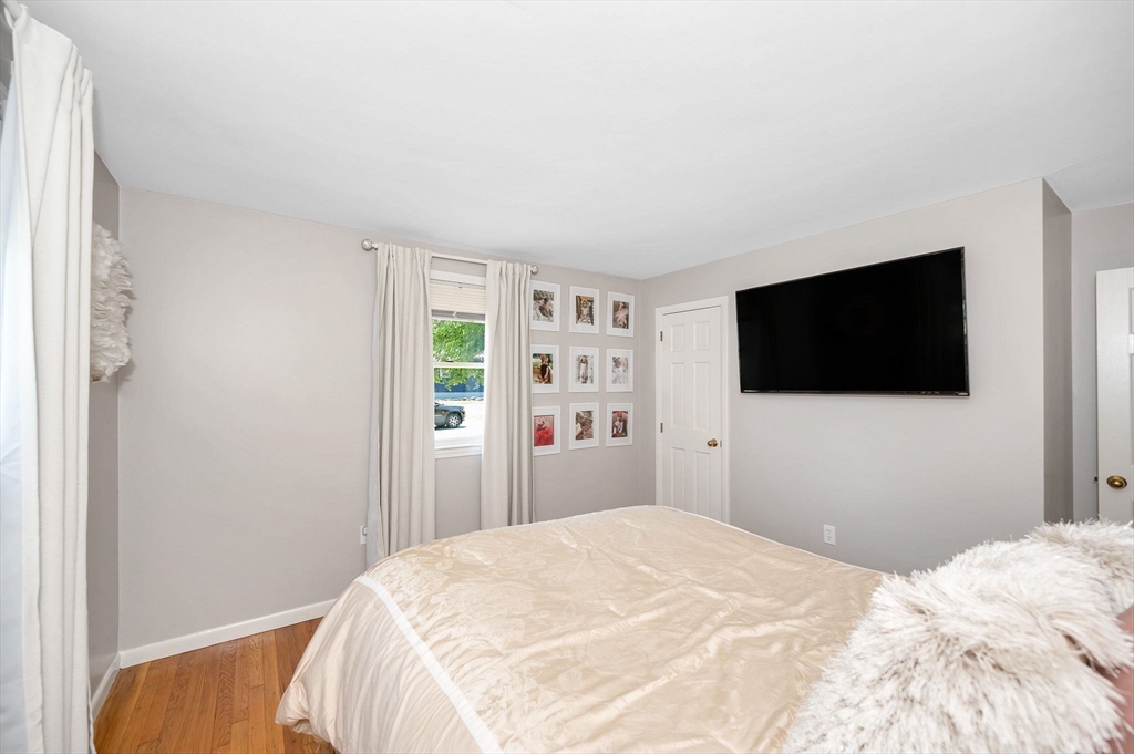 5 Silverbirch Road Billerica, MA 01821 - Photo 16 of 36 a bedroom with a bed and a flat screen tv