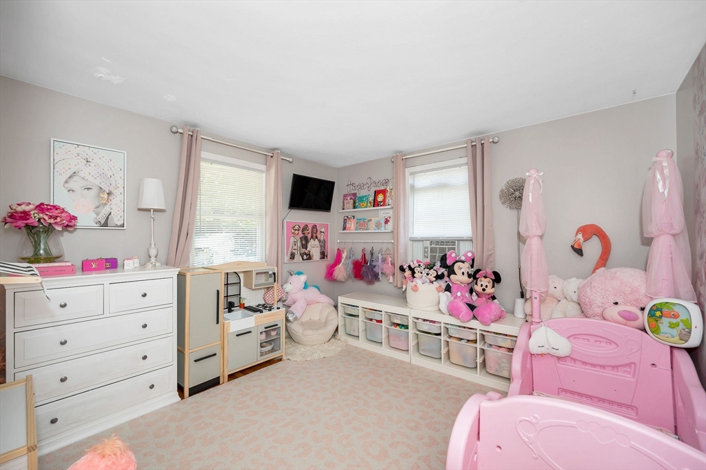 5 Silverbirch Road Billerica, MA 01821 - Photo 23 of 36 a bedroom with a bed closet and a window
