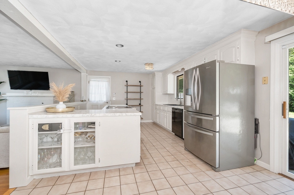 5 Silverbirch Road Billerica, MA 01821 - Photo 5 of 36 a kitchen with a refrigerator sink and cabinets