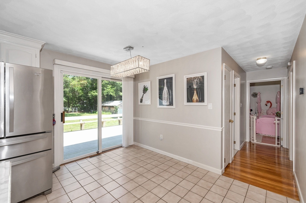 5 Silverbirch Road Billerica, MA 01821 - Photo 8 of 36 a view of a hallway view with wooden floor and cabinet