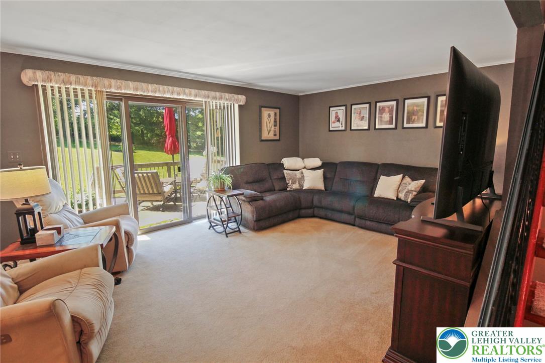 3470 Brodhead Road Bethlehem, PA 18020 - Photo 37 of 84 Sun-drenched living space opens to a serene outdoor deck through sliding glass doors.