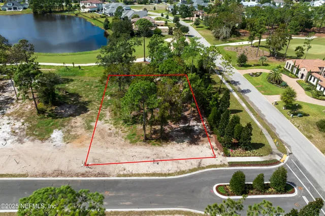 a view of a swimming pool with outdoor seating and plants