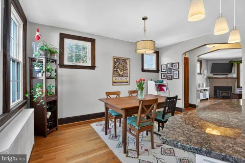 a workspace with furniture window and wooden floor